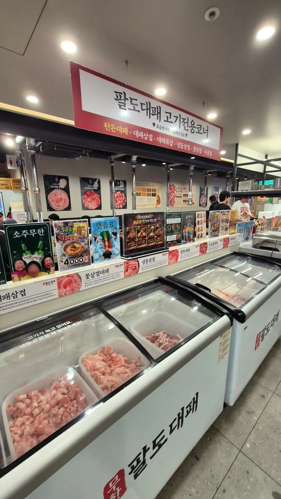Self-serve bar displaying pork shoulder shavings and flower pork belly