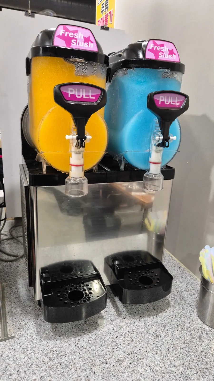Self-serve drink corner with a slushie machine