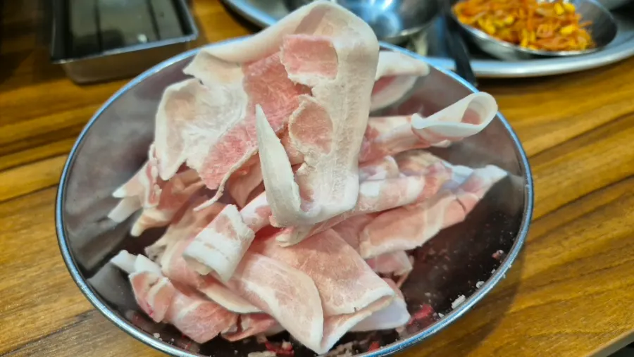 A plate of shaved pork brought from the self-serve bar