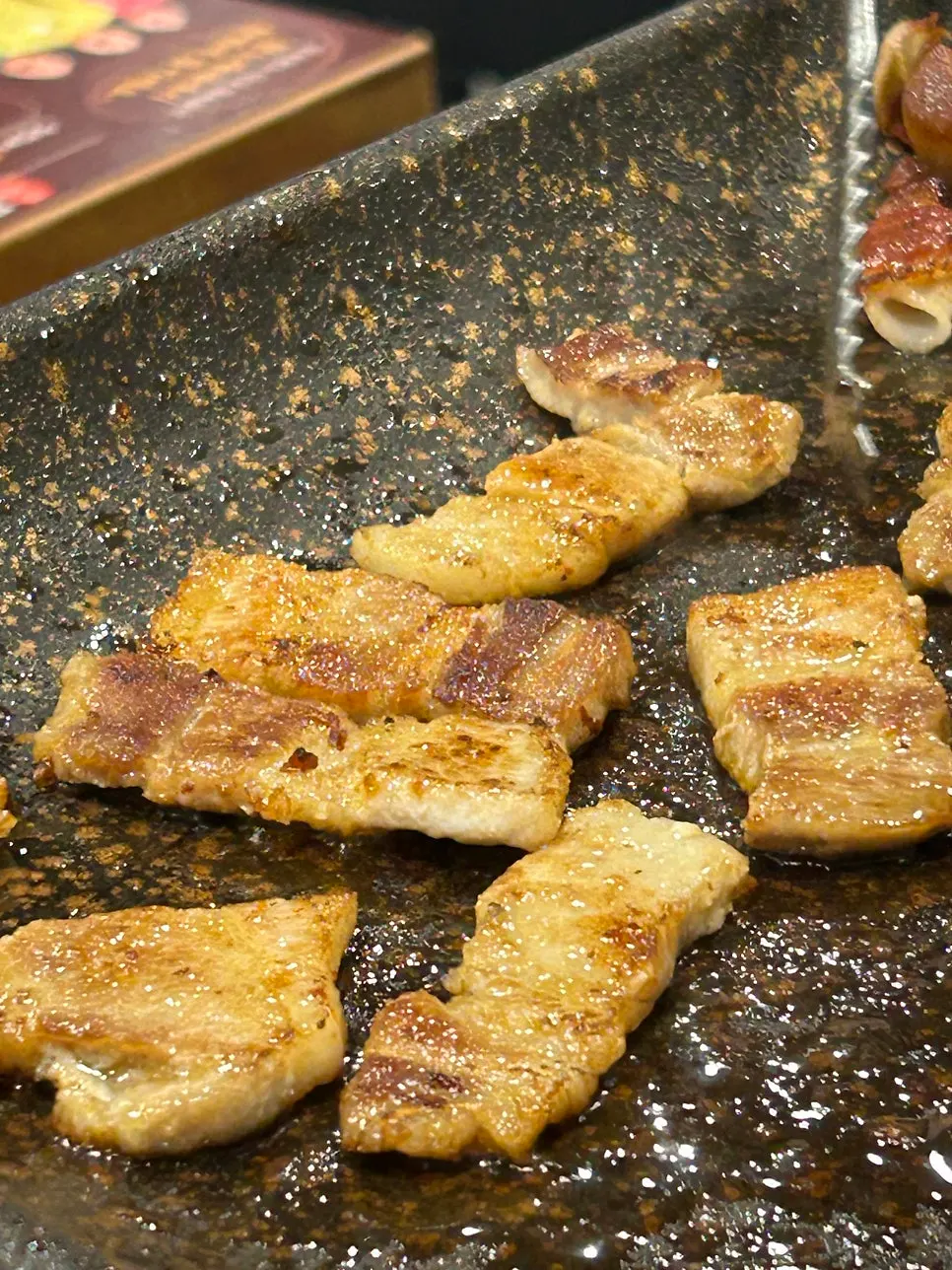 Sign explaining the 6 types of all-you-can-eat shaved pork