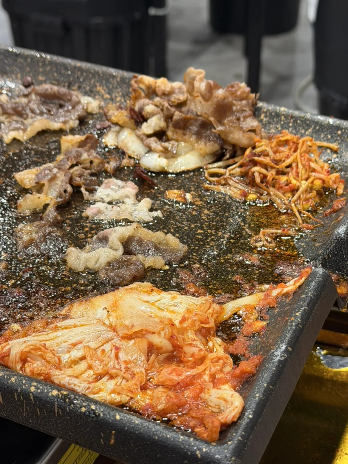 Various types of shaved meat on the grill plate