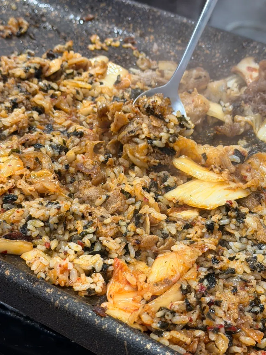 Self-made fried rice cooking on the grill plate
