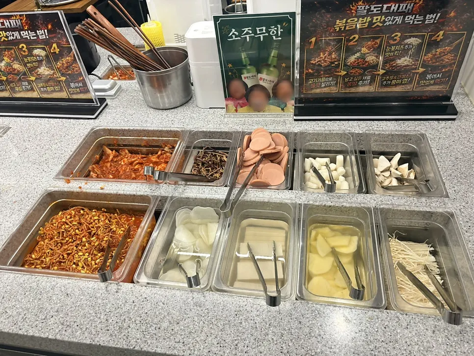 Self-serve bar with vegetables, mushrooms, and wrap greens