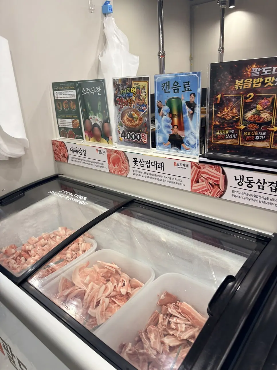 Shaved pork belly and other meats on display