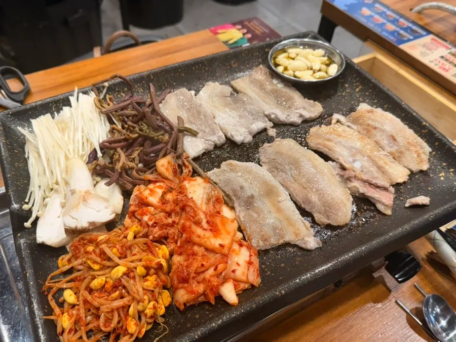 Raw shaved pork belly on a plate