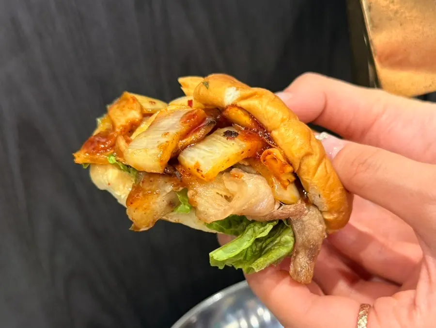 Shaved pork belly sizzling on the grill