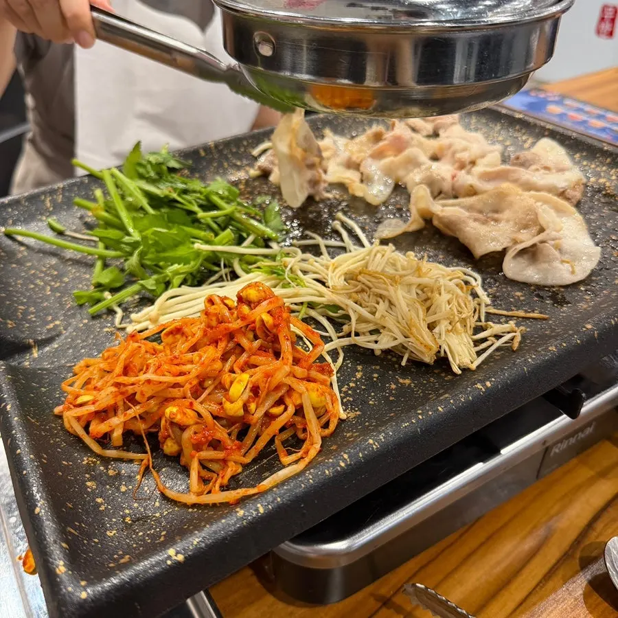 A plate combining meat and lettuce wraps