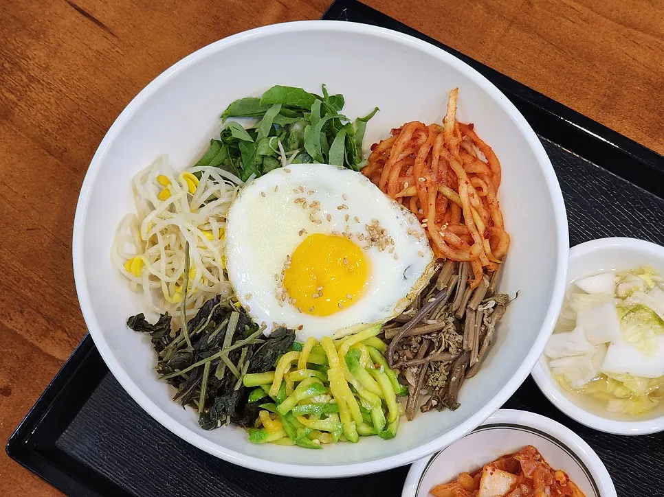 Table set with shrimp keto gimbap and beef gochujang bibimbap together