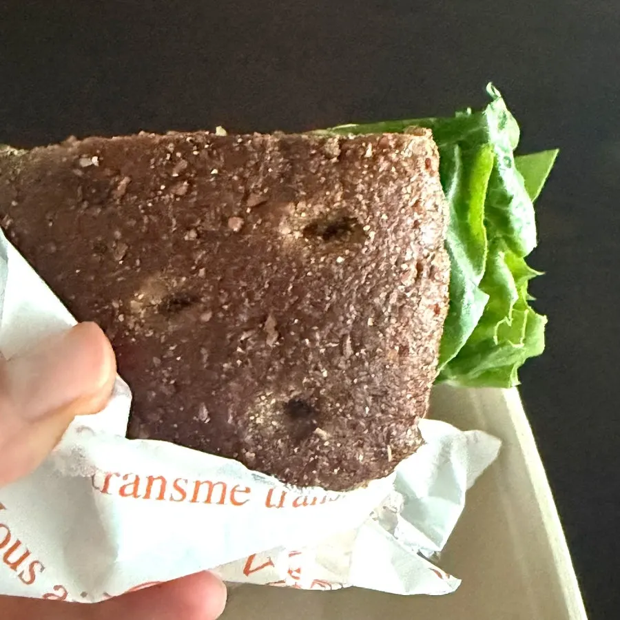 Inside of the caprese bun with romaine-filled rye bread