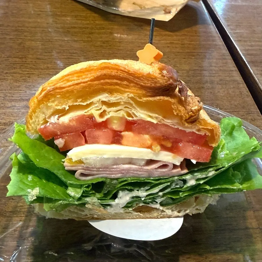 Ham cheese croissant pinned together in halves