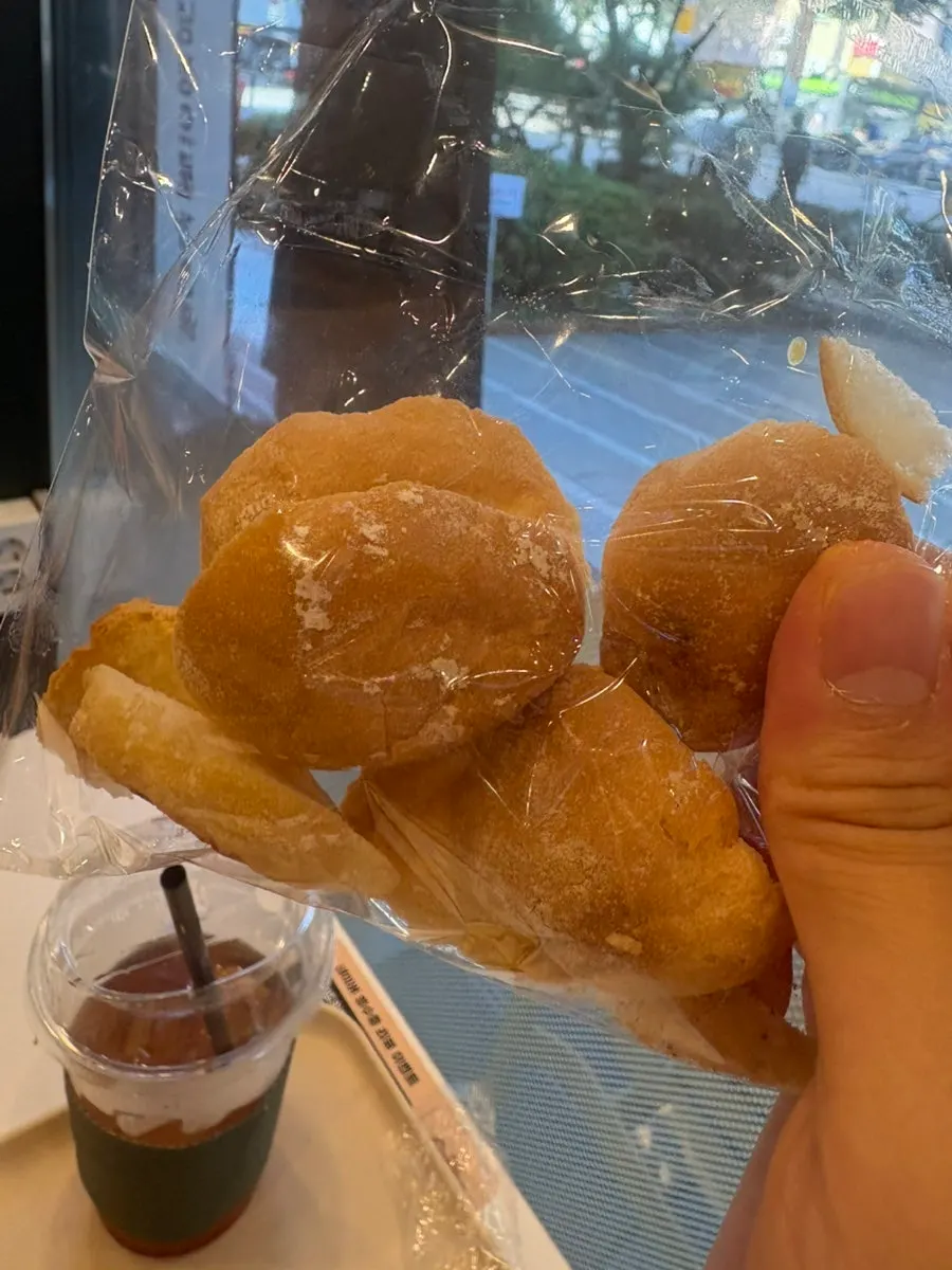 Dipping baguette into the pumpkin soup
