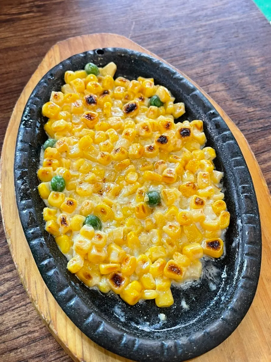 Corn cheese served as banchan at the sashimi restaurant