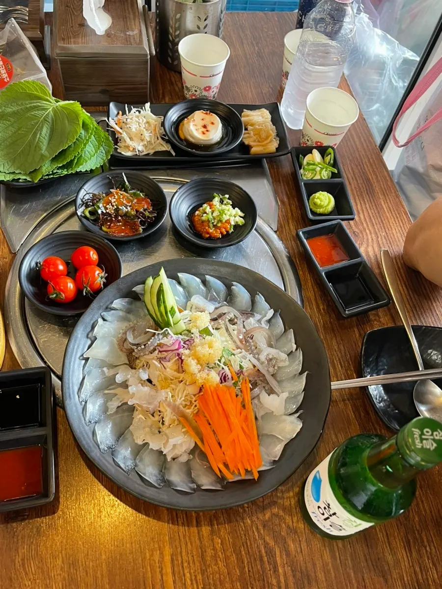 Full table spread with ojingeopo and banchan