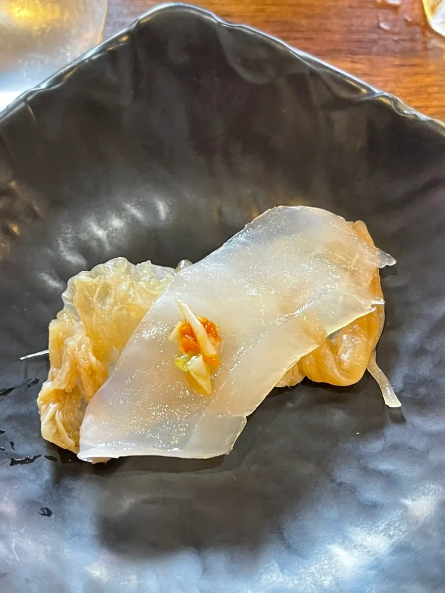Ojingeopo wrapped in aged kimchi as a kimchi roll