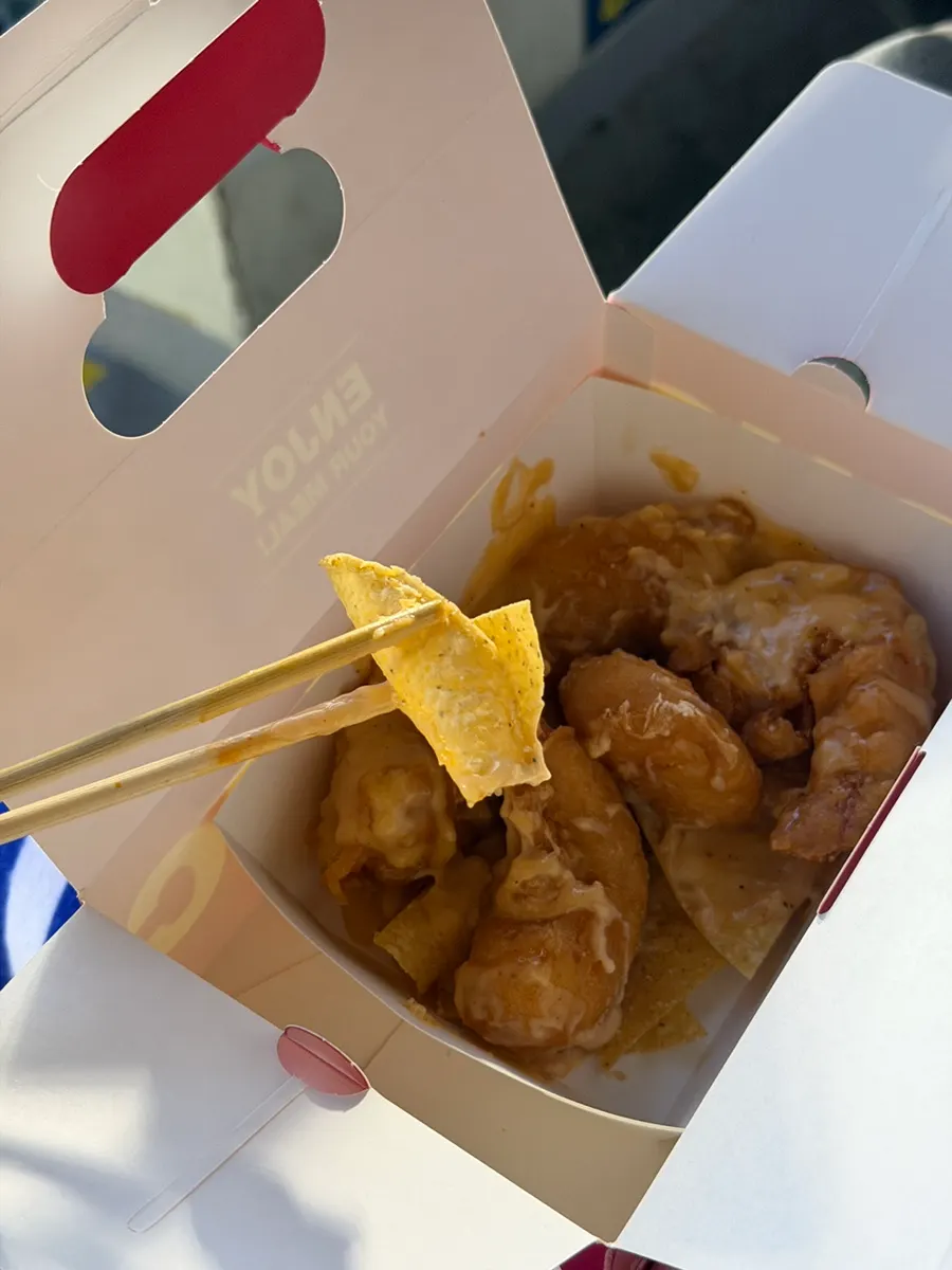 Picking up a piece of fried shrimp
