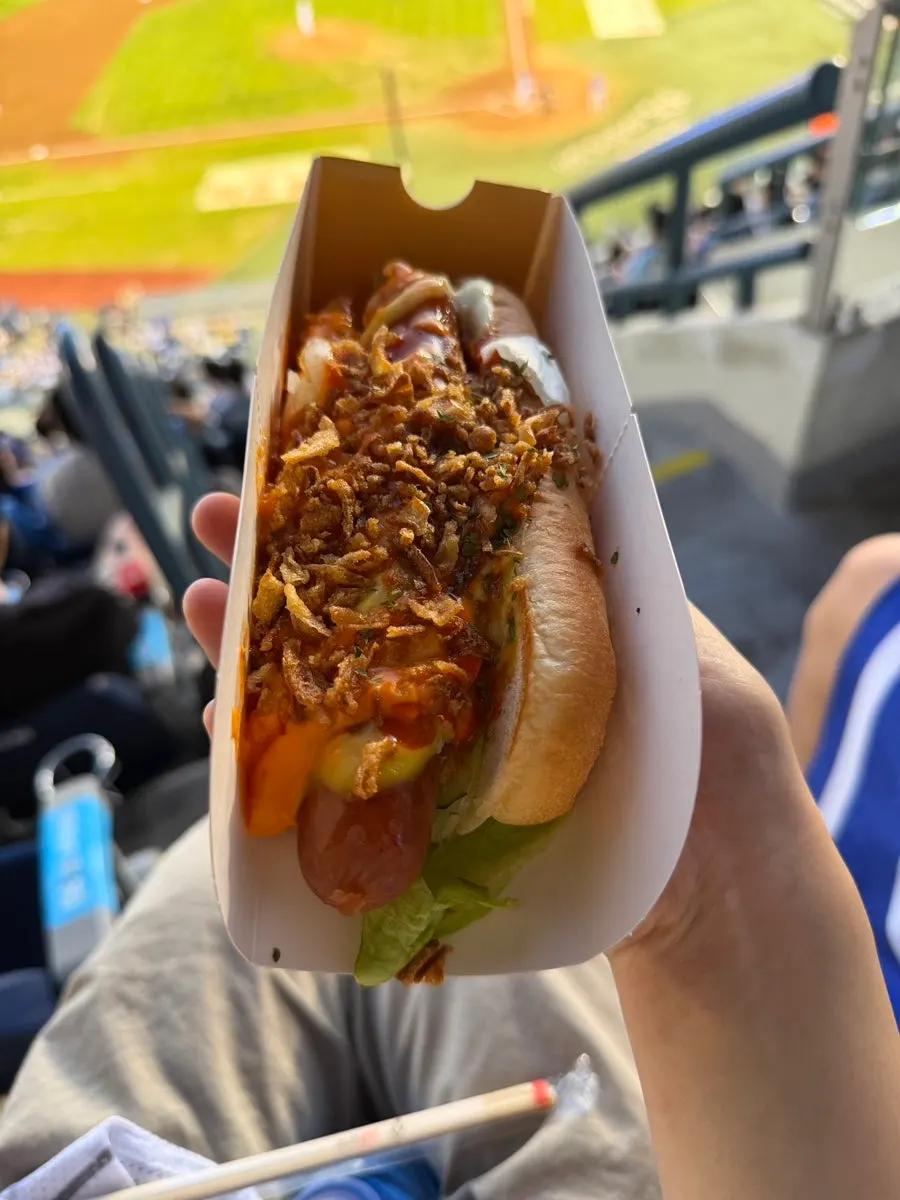 Unwrapping the chili cheese hot dog