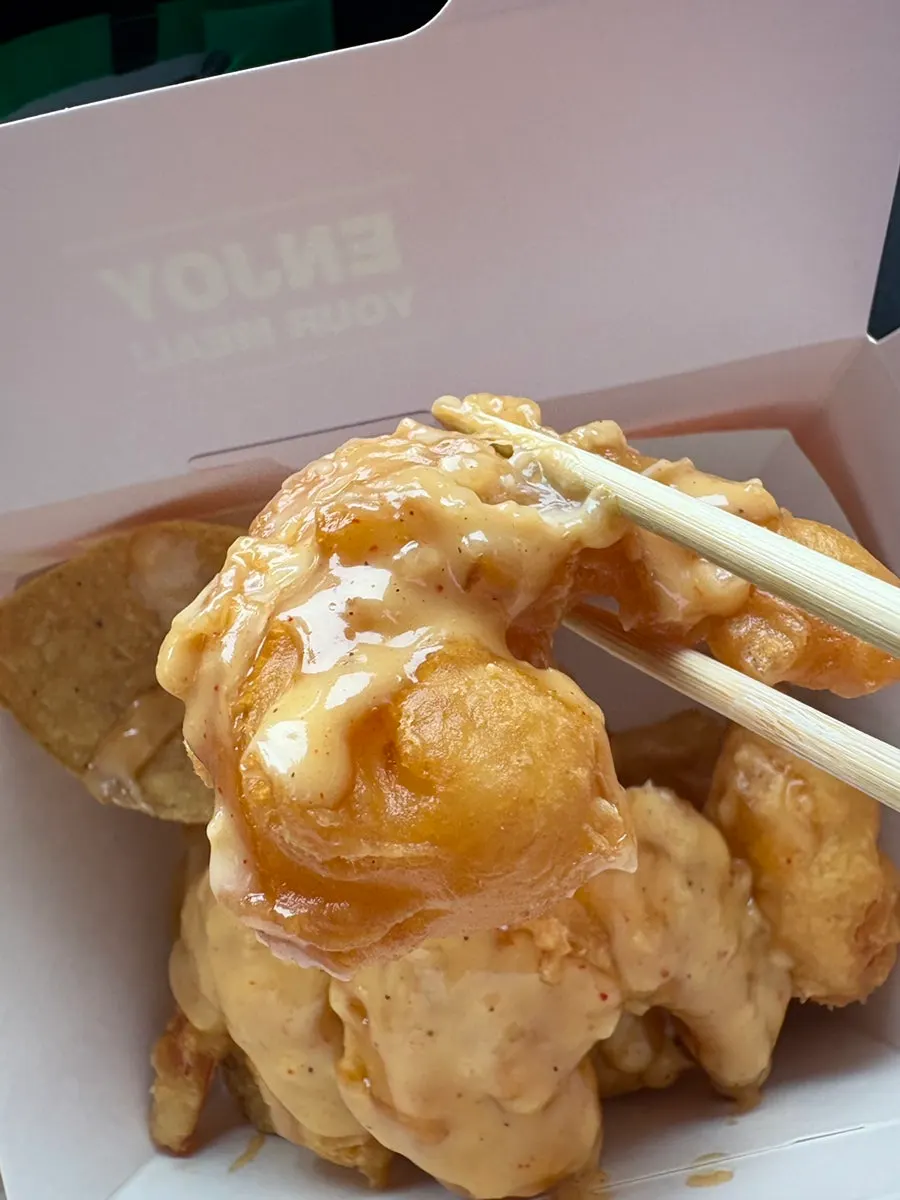 Station Nacho cream shrimp in a takeout container