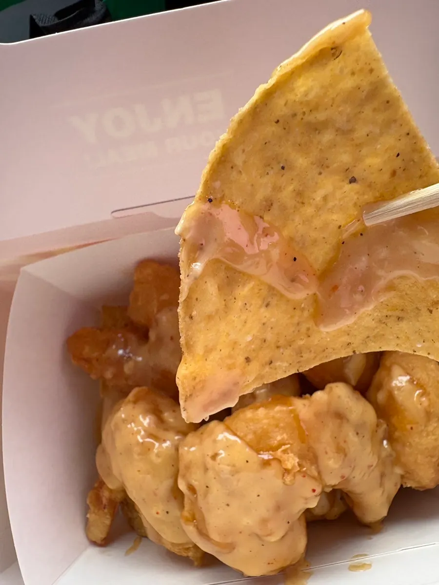 Nachos layered underneath the cream shrimp