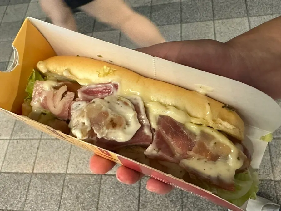 Bacon white garlic hot dog piled high with bacon