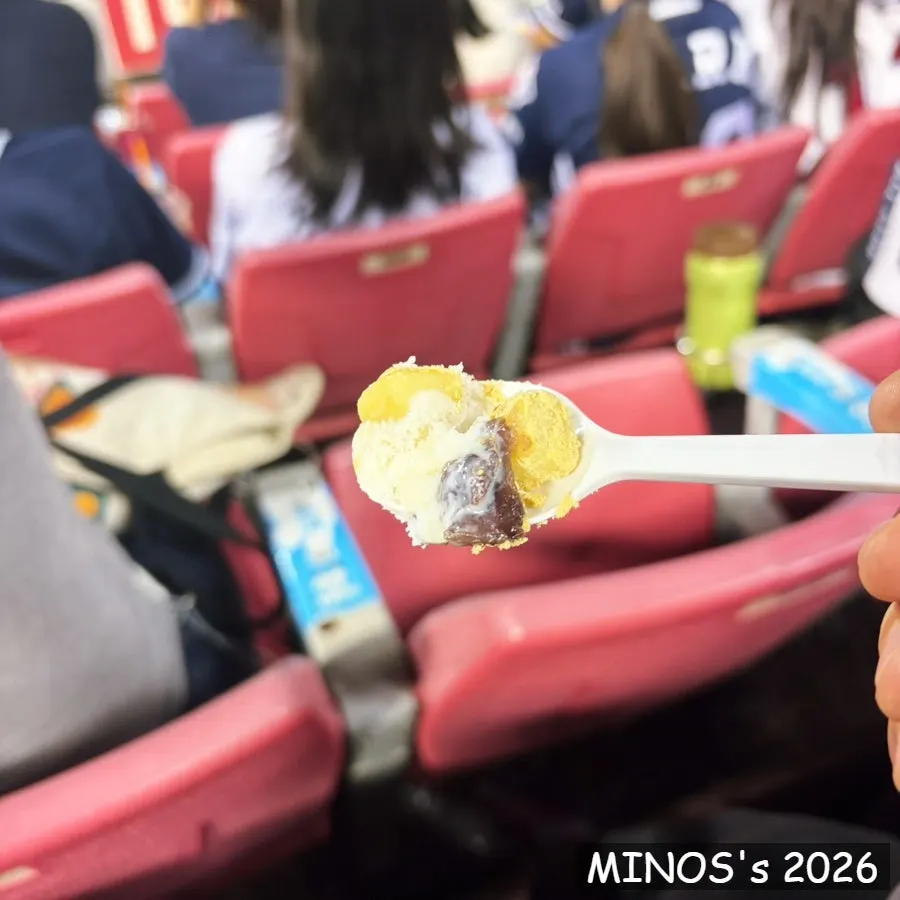 Eating patbingsu in the stadium seats during early evening