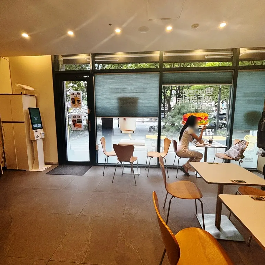 Cozy interior with a full glass wall