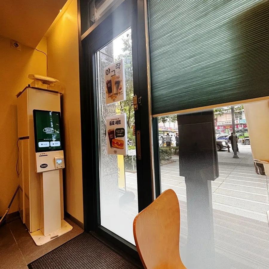 Kiosk and bar table near the entrance