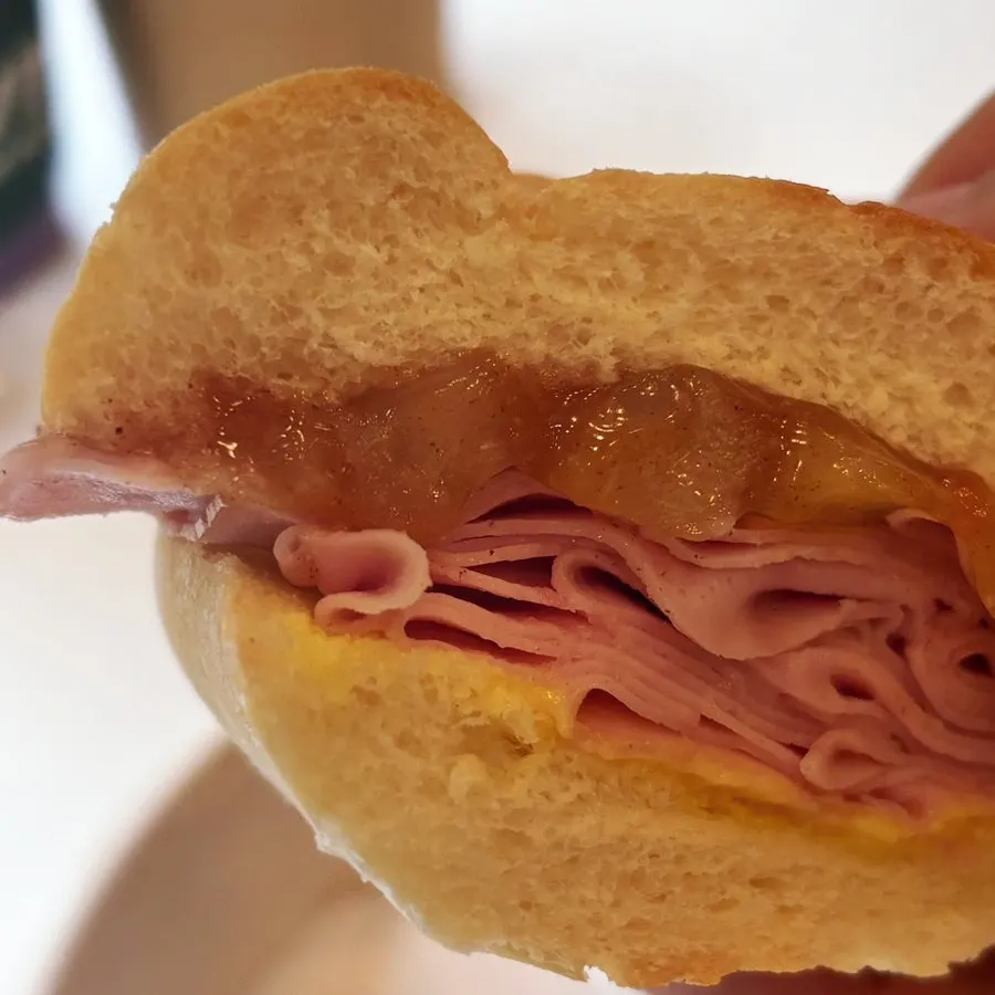 Close-up of the crispy baguette and ham filling