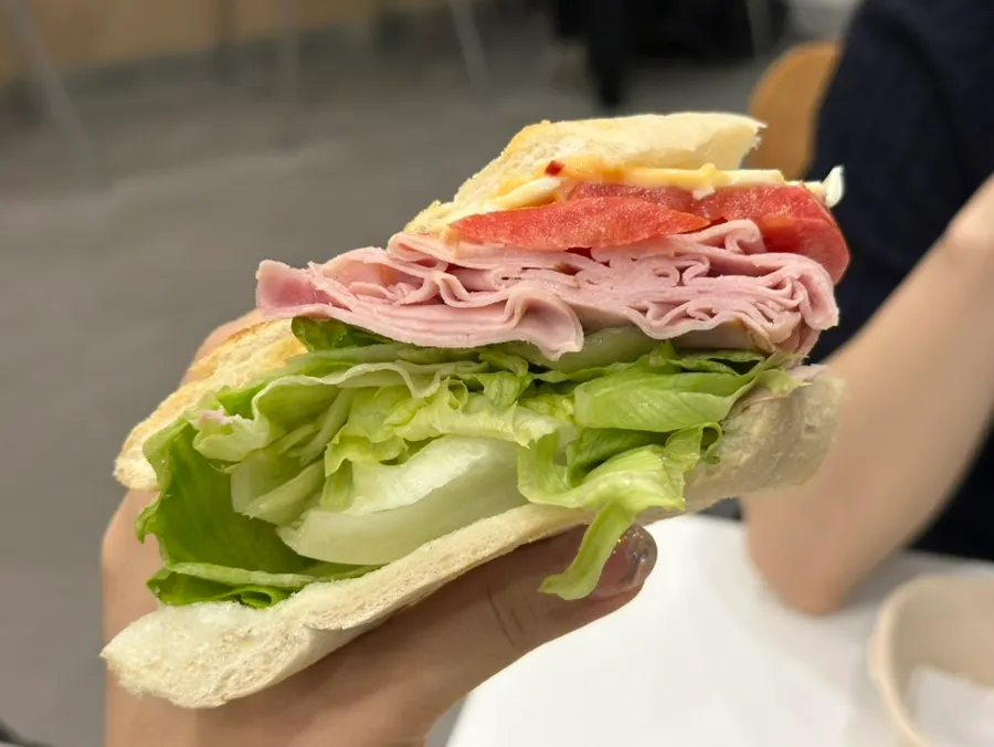 Cross-section of the Town Sandwich packed with ham and lettuce