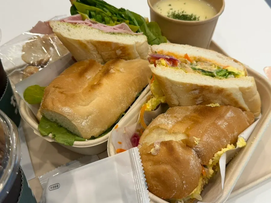 Two sandwiches and a drink set on the table