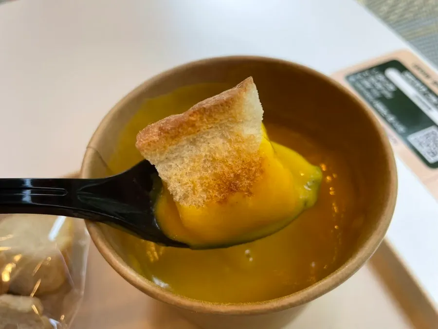 Plate with egg mayo bánh mì and pumpkin soup together