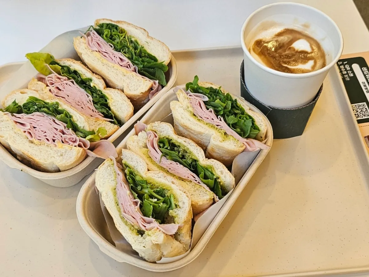 Two sandwiches and a caffè latte on the table