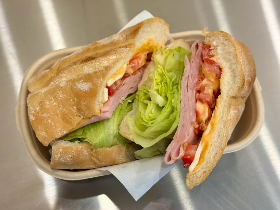 Close-up of a crispy-outside, soft-inside baguette sandwich