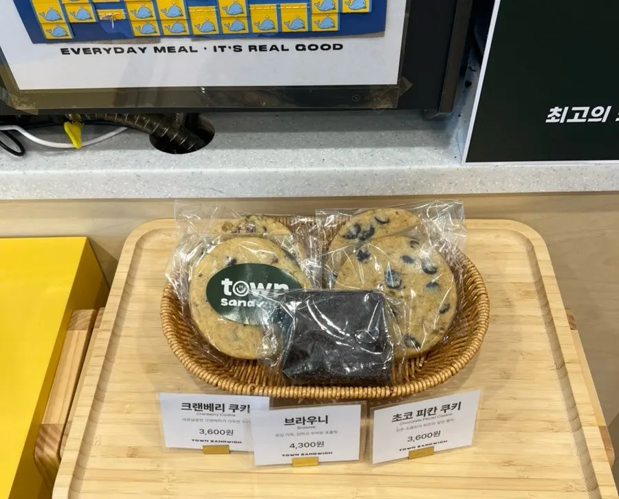 Sriracha sauce and cookies for sale on one side of the store
