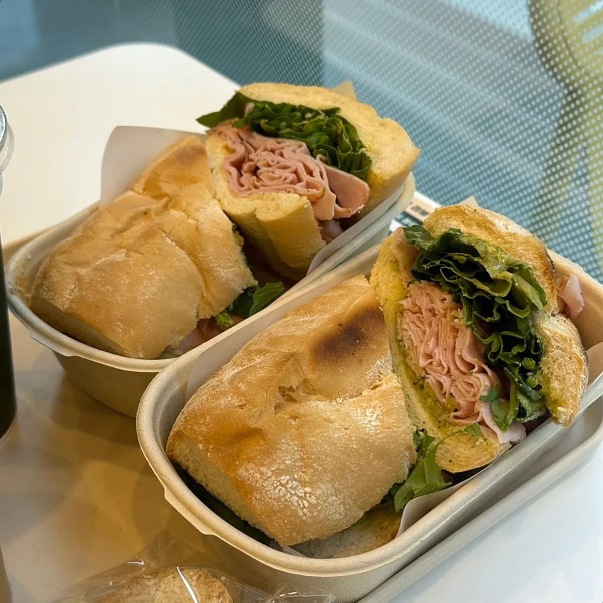 Two jambon-beurres, one with basil butter and one with truffle butter