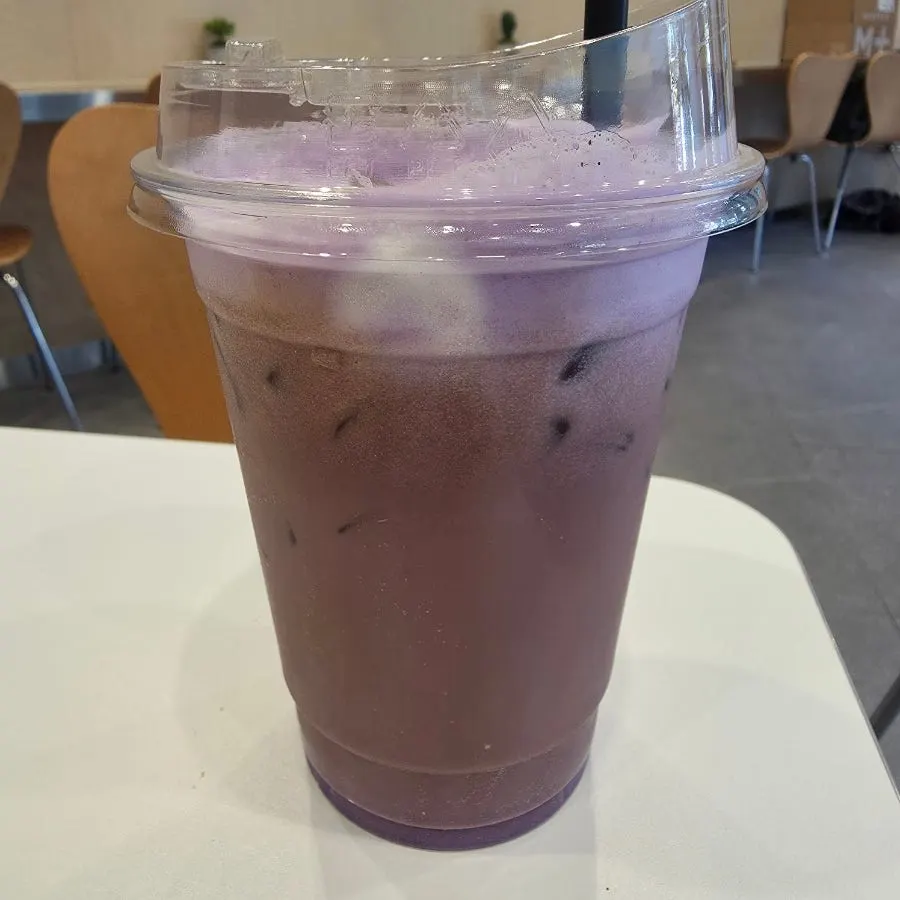 A cup of ube espresso latte, decaf