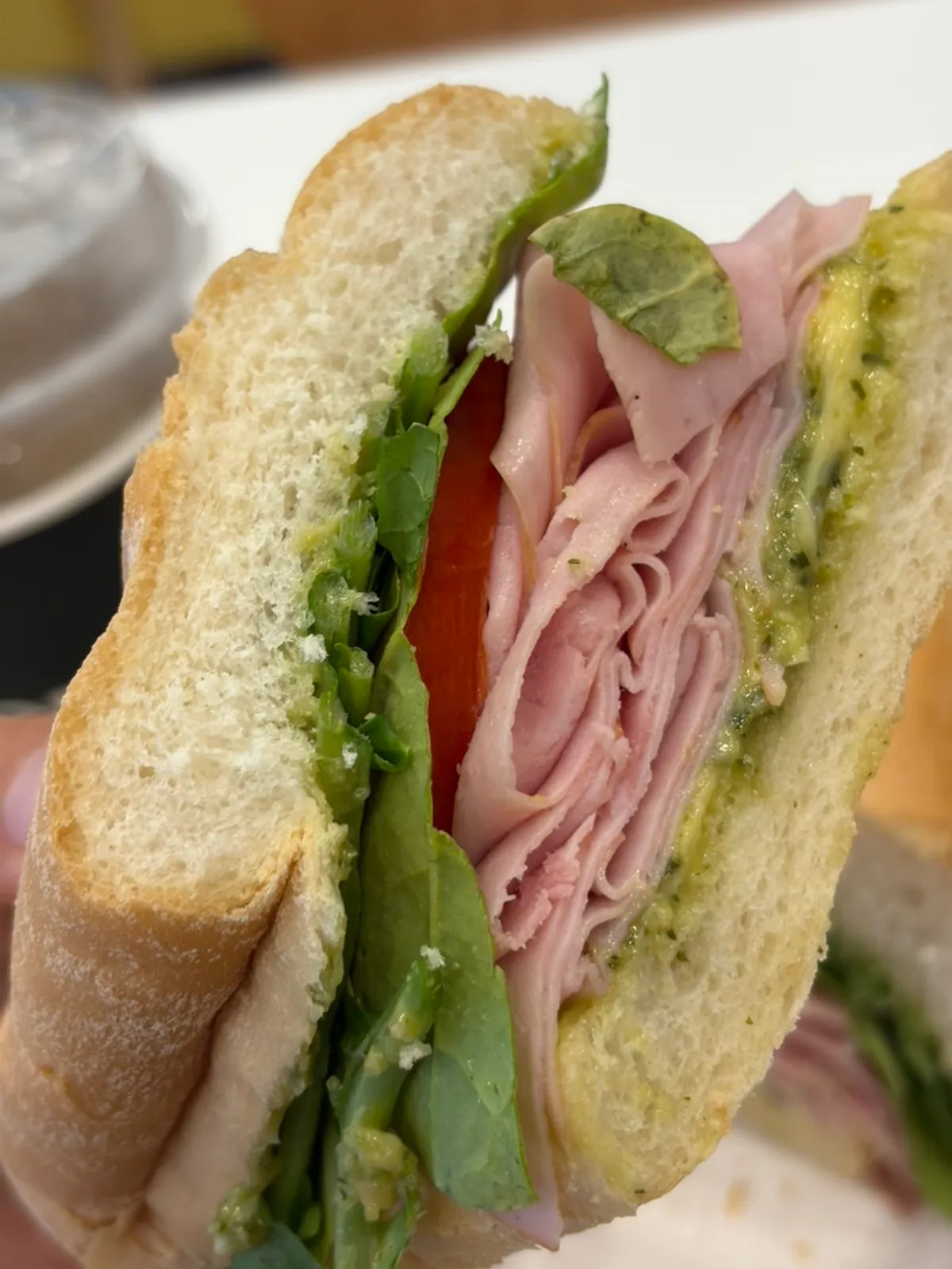 Basil jambon-beurre sandwich cut into two