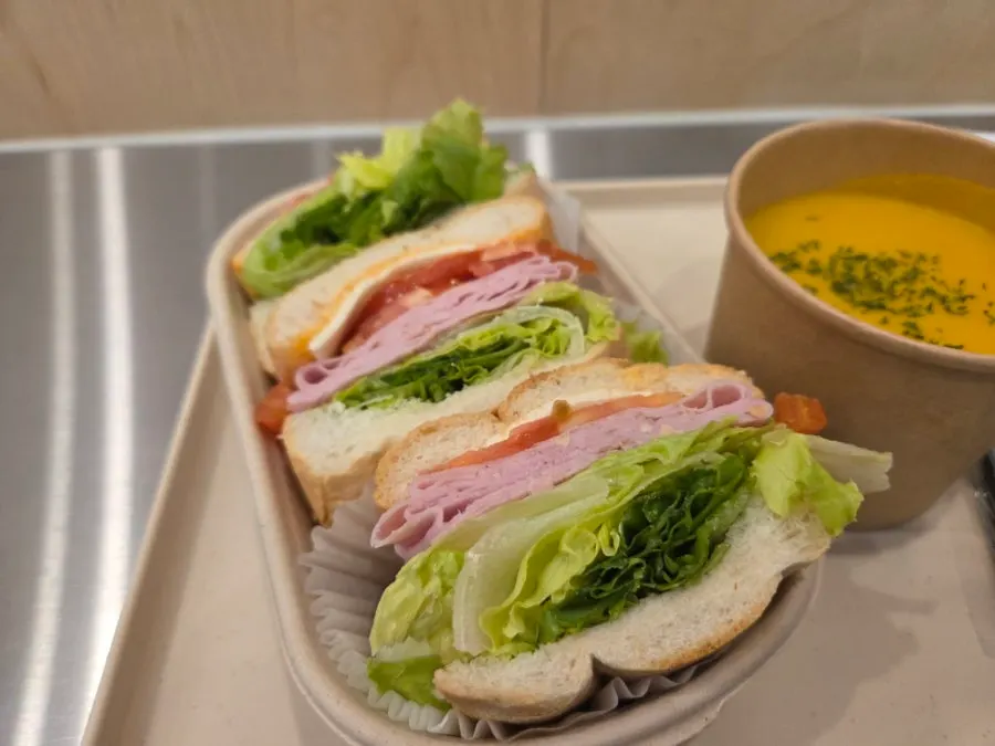 Table spread of Town Sandwich, sweet pumpkin soup, and iced americano set