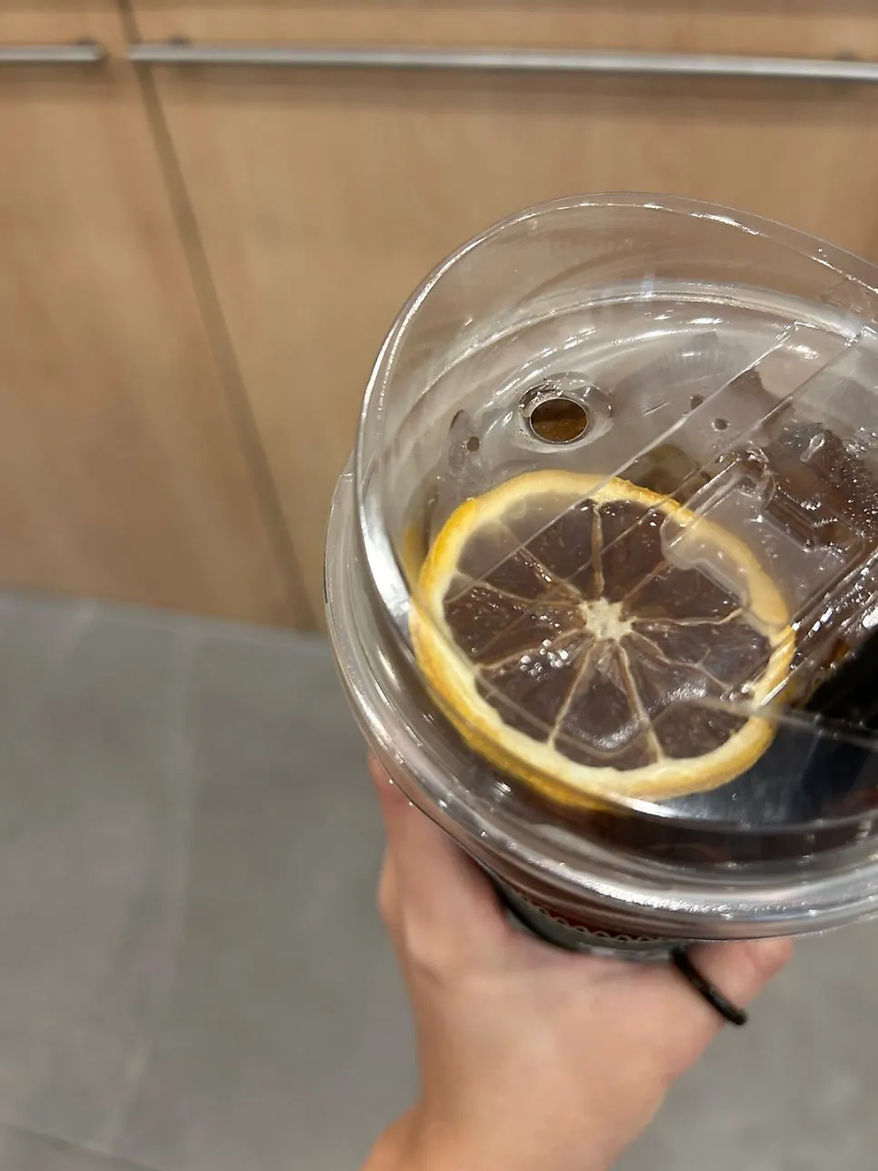 Iced tea placed beside the sandwich