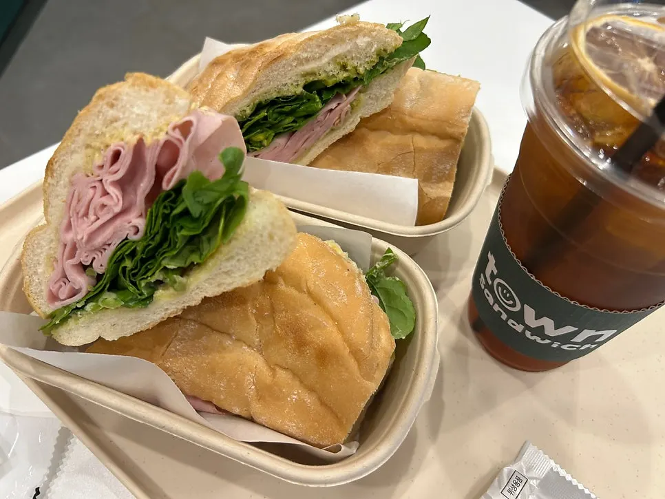 A brunch spread with jambon-beurre sandwich and drink
