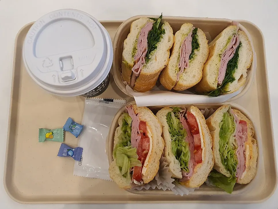 Table setup with the Town Sandwich and basil jambon-beurre order