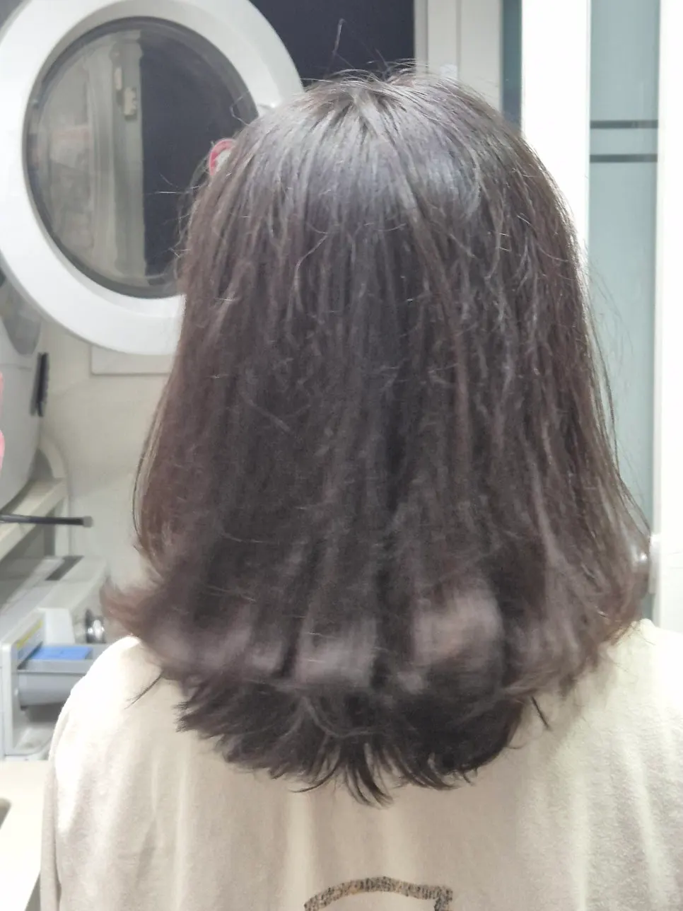 Hair condition being examined during consultation