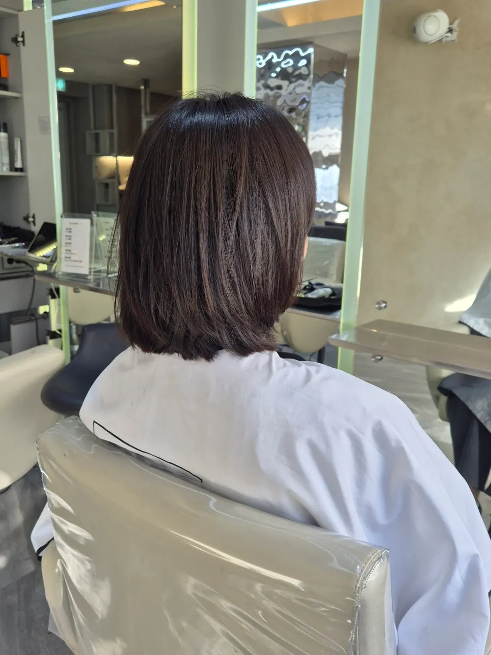 Bob with layered face-framing pieces and bangs