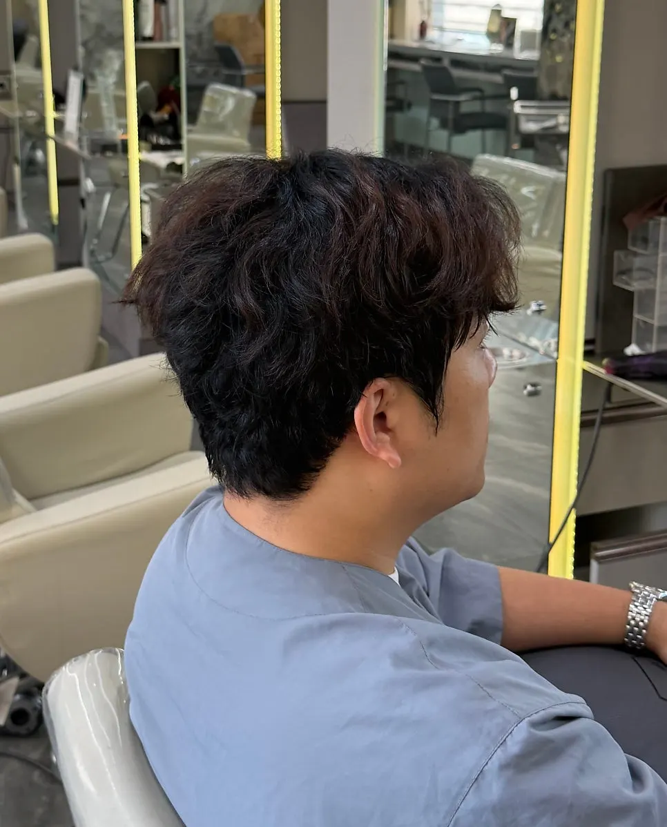 Hair checked in the mirror before the treatment