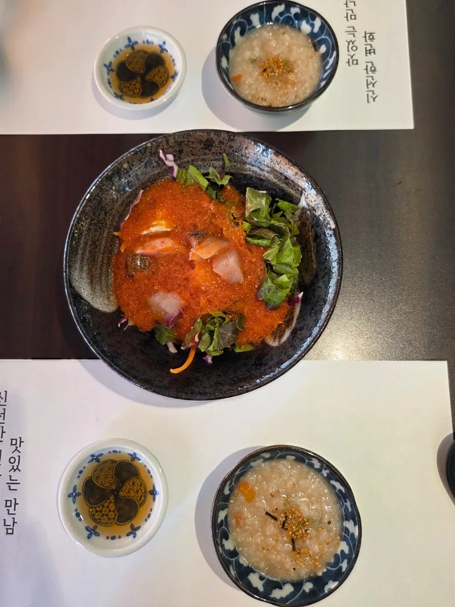 Porridge and sashimi salad served before the sashimi omakase spread