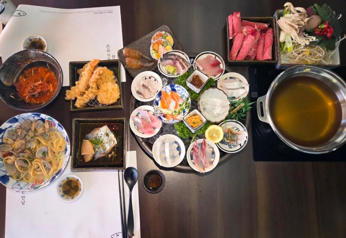 Sashimi omakase spread laid out with many dishes
