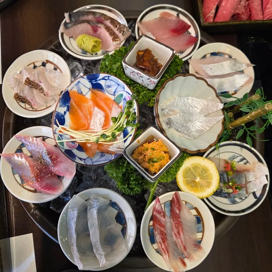 Sashimi platter filled with several kinds of aged fish