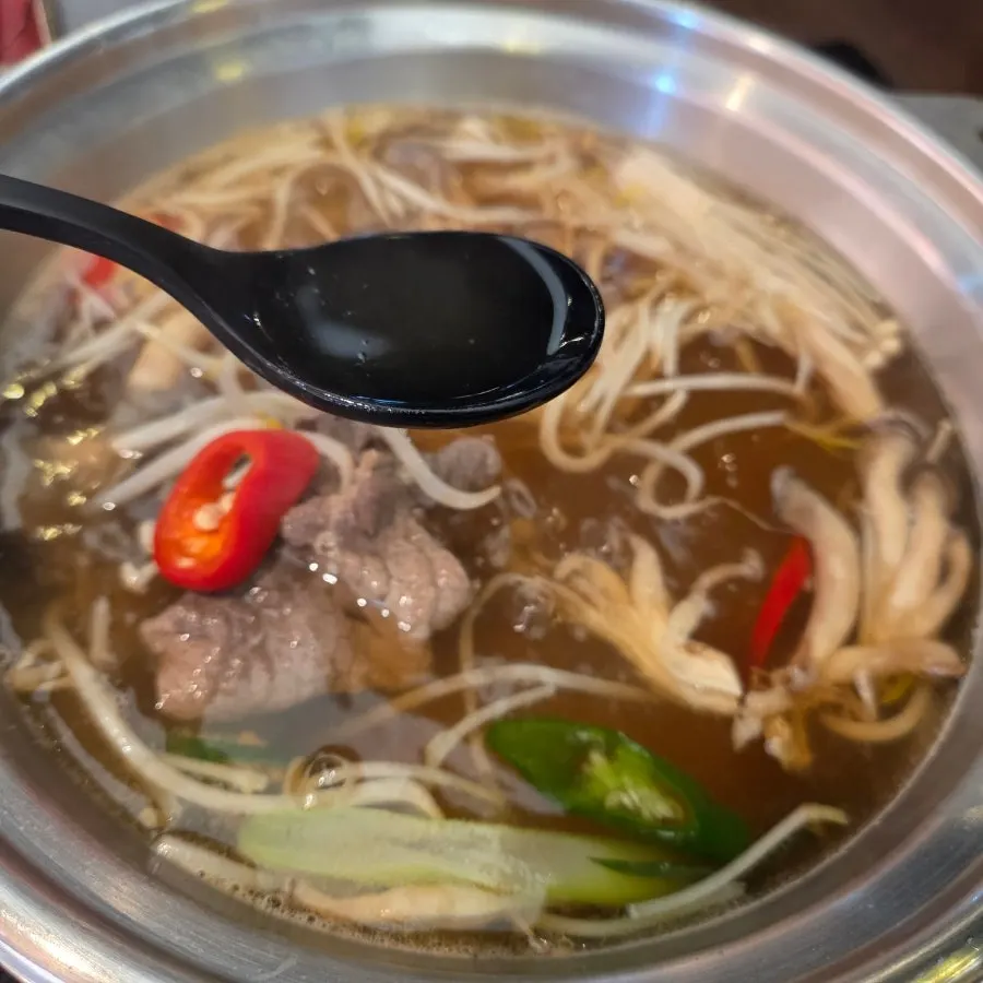 Shabu-shabu broth with meat and vegetables