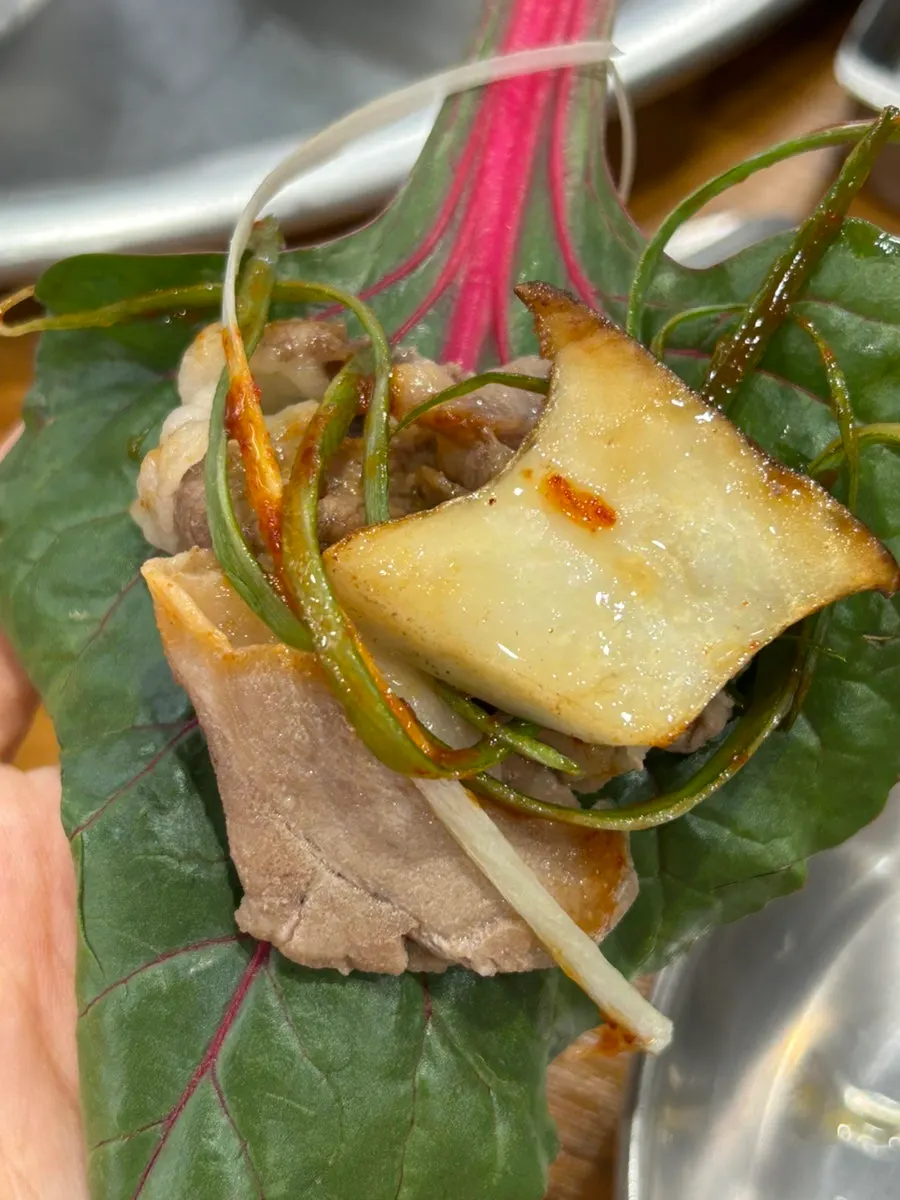 Shaved beef brisket and kimchi on the grill