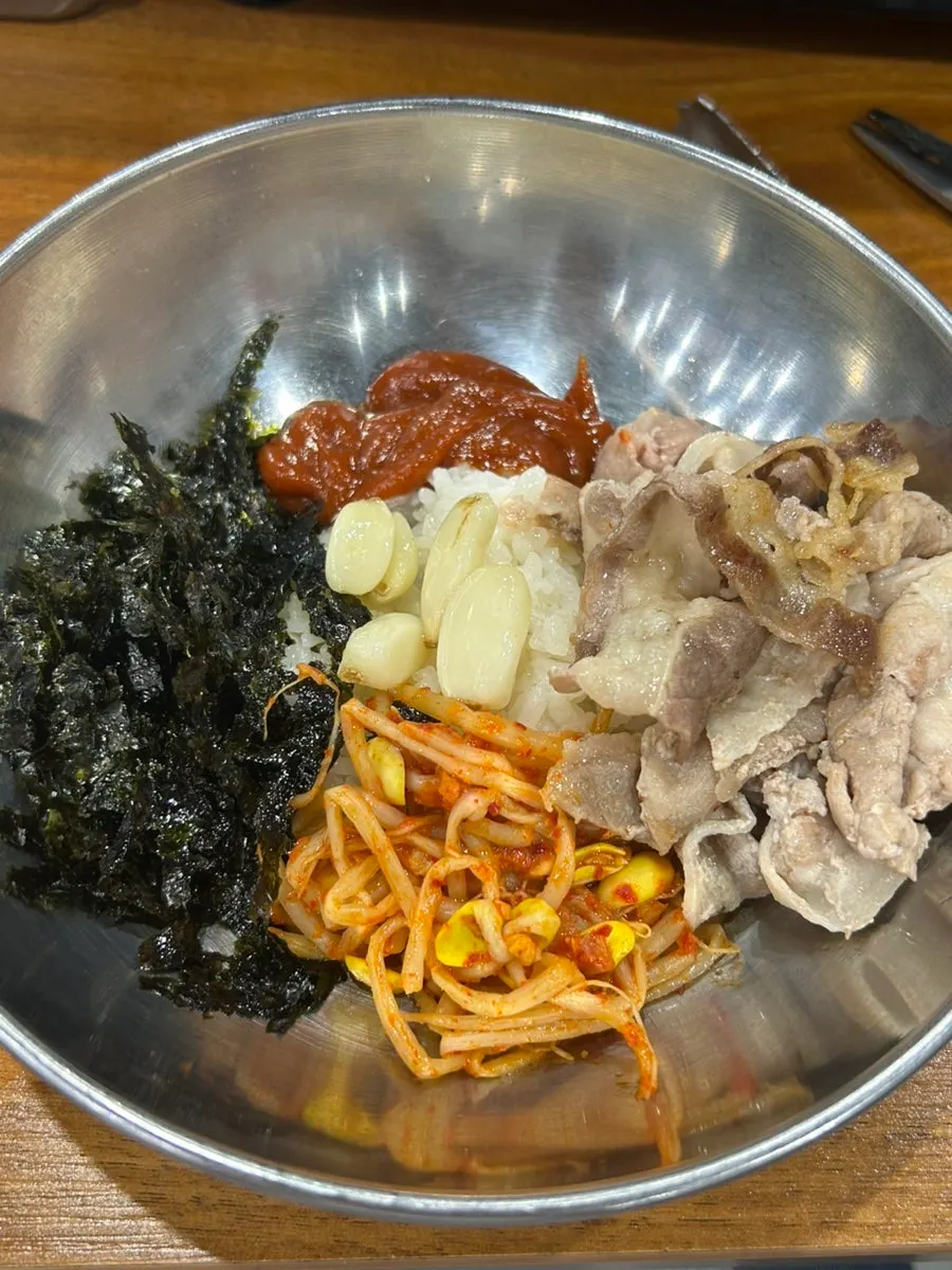 Table with ramen and shaved pork