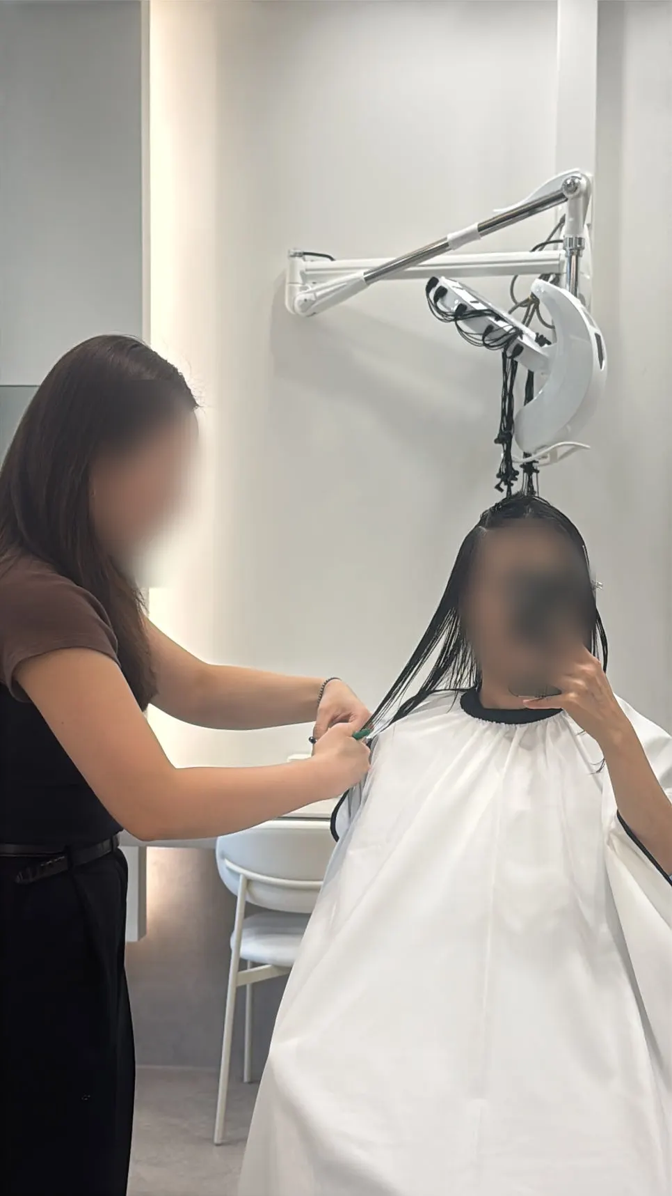 Long hair reaching above chest length before the cut